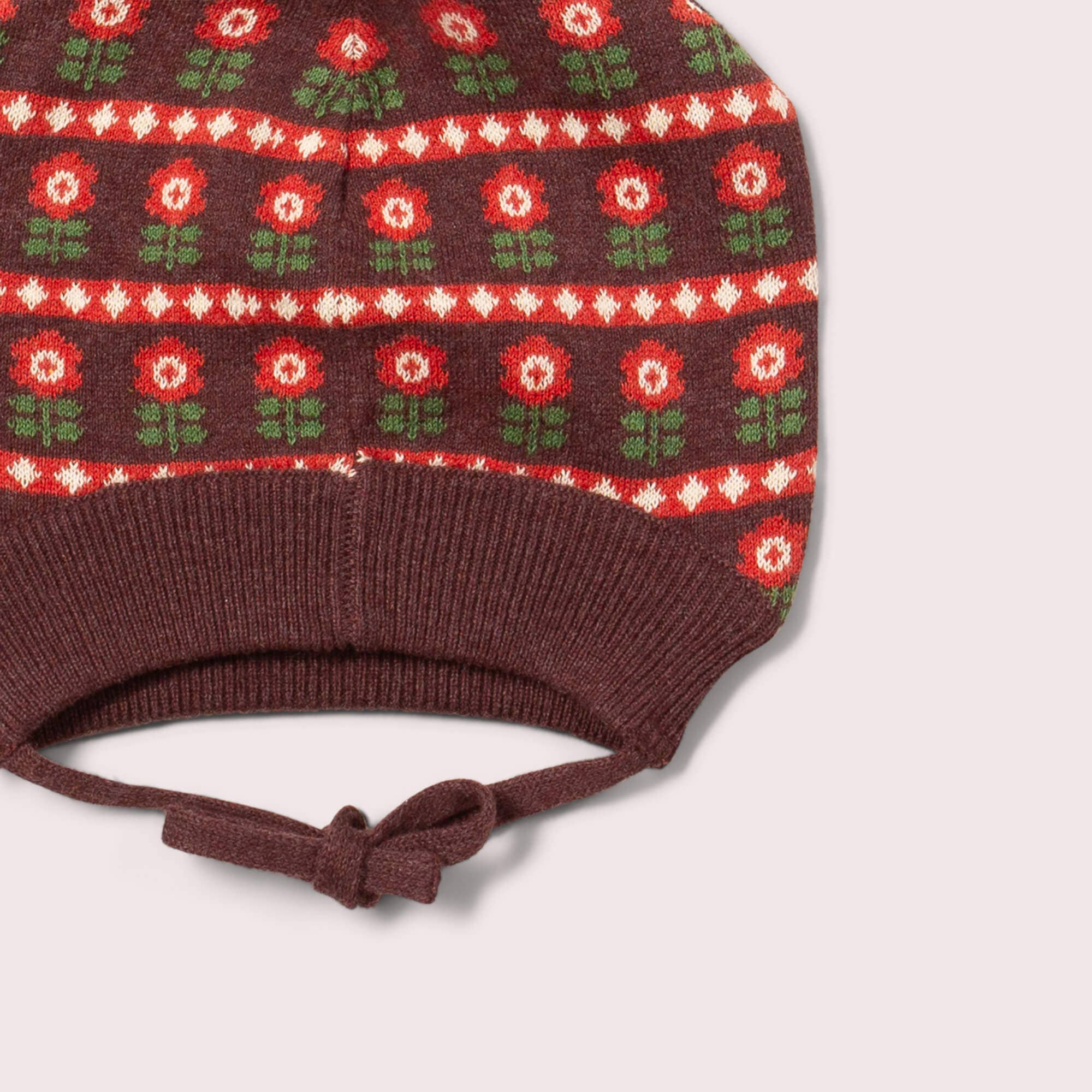 Knitted hat with floral pattern on a white background